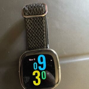 Nice Fitbit Sense w/ charging cord.